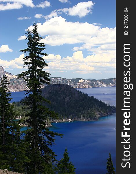 Crater Lake, located in central Oregon, on a warm, sunny day. Crater Lake, located in central Oregon, on a warm, sunny day