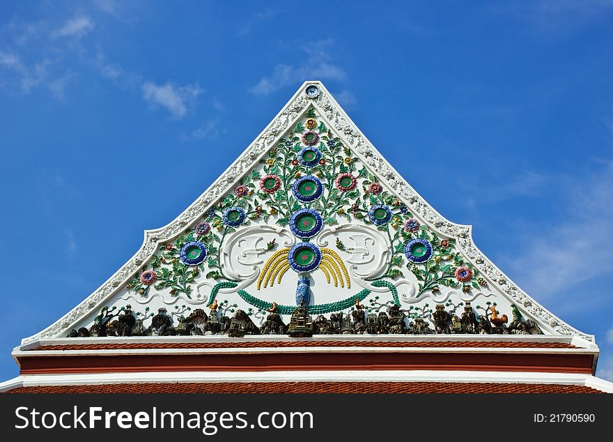 Detail of ceramic ornately decoration at temple roof in Bangkok, Thailand. Detail of ceramic ornately decoration at temple roof in Bangkok, Thailand