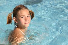Girl Swimming In The Pool Stock Images