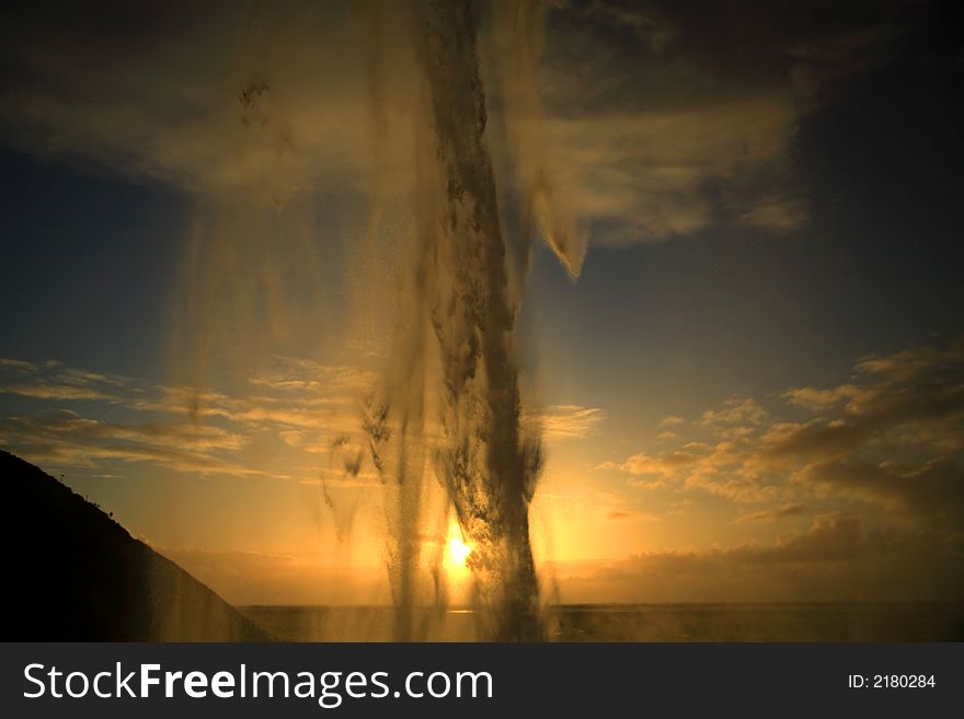 Sunset through Seljalandsfoss waterfall in Iceland