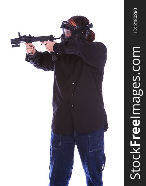 Isolated man in mask and holding gun and getting ready to shoot. Isolated man in mask and holding gun and getting ready to shoot.