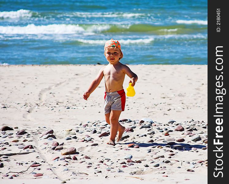 Young boy playing at the beach. Young boy playing at the beach.