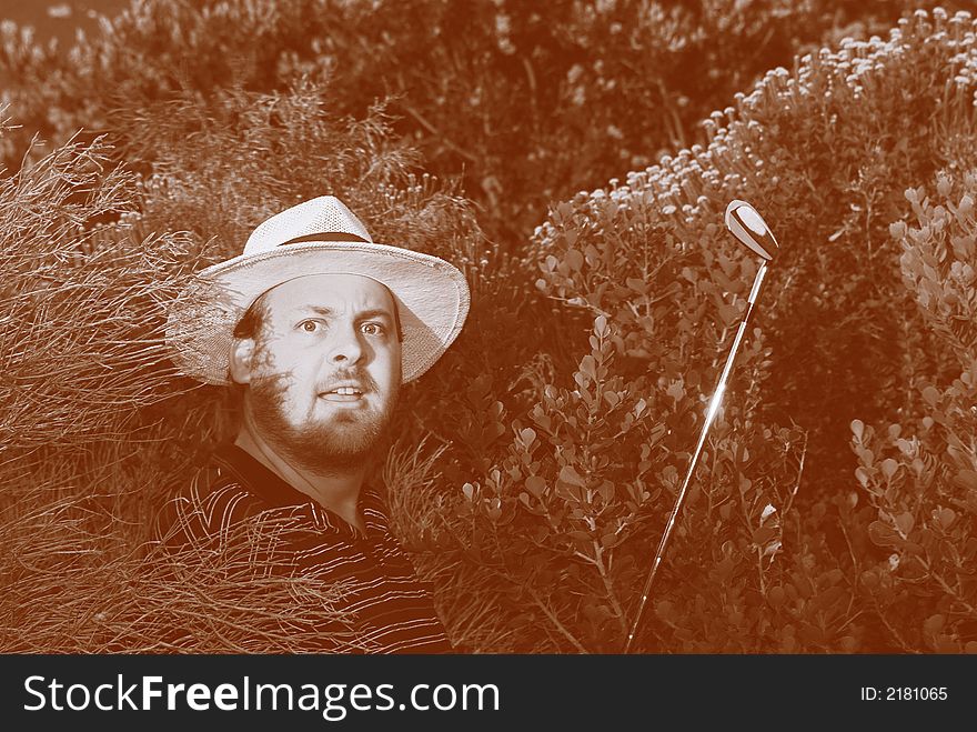 Shocked golfer looking for his golfball in the bushes. Color resembling aged film. Shocked golfer looking for his golfball in the bushes. Color resembling aged film.