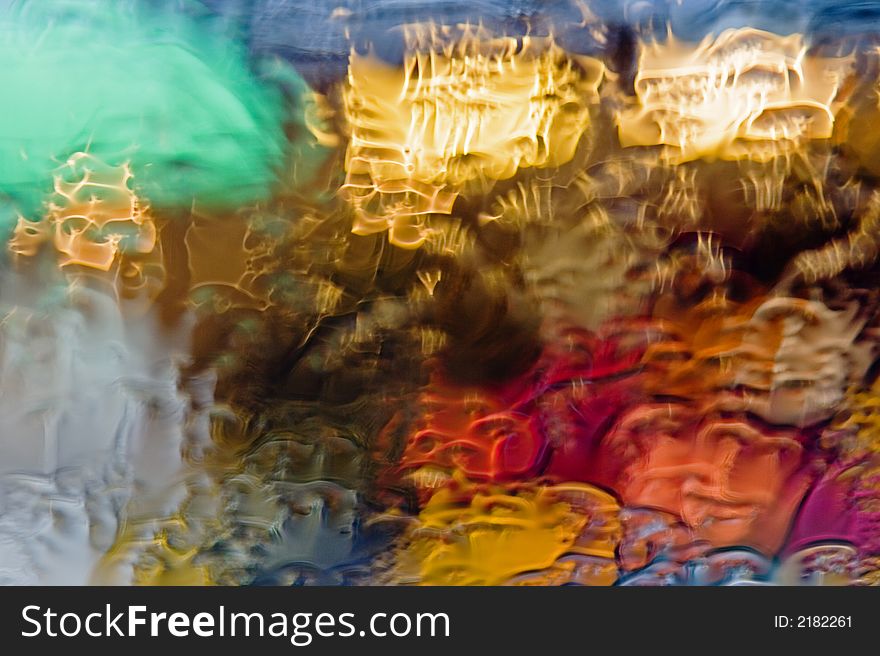 Colored drops on the glass, red, yellow, green, blue colors