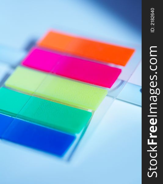 Multicoloured small plastic stickers macro. Multicoloured small plastic stickers macro