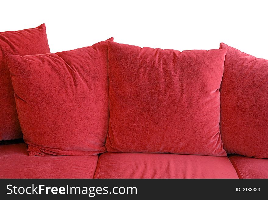 Red sofa with velvet pillows