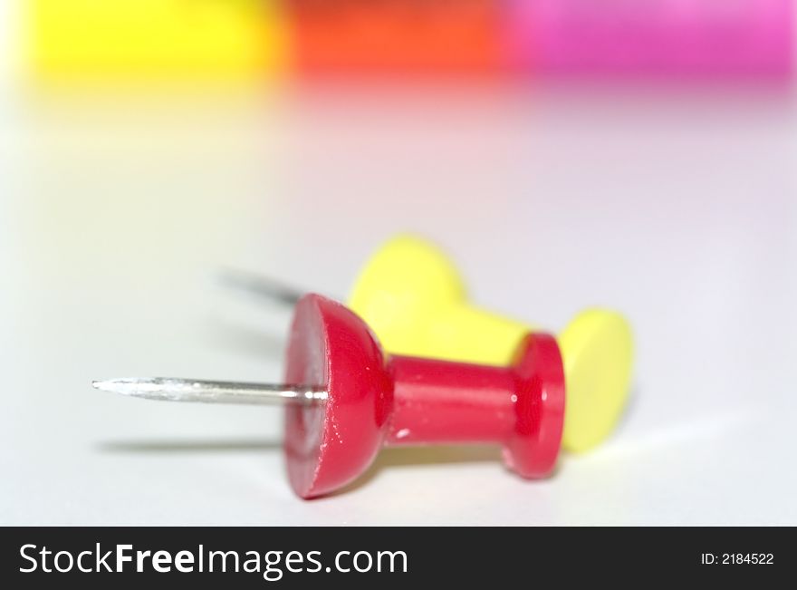 An abstract of red and yellow push pins