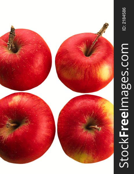 Composition from four big red apples on white background