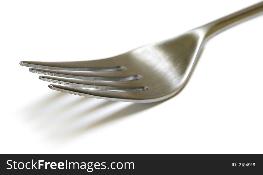 Stainless Steel Fork close up with shallow DOF isolated on white background