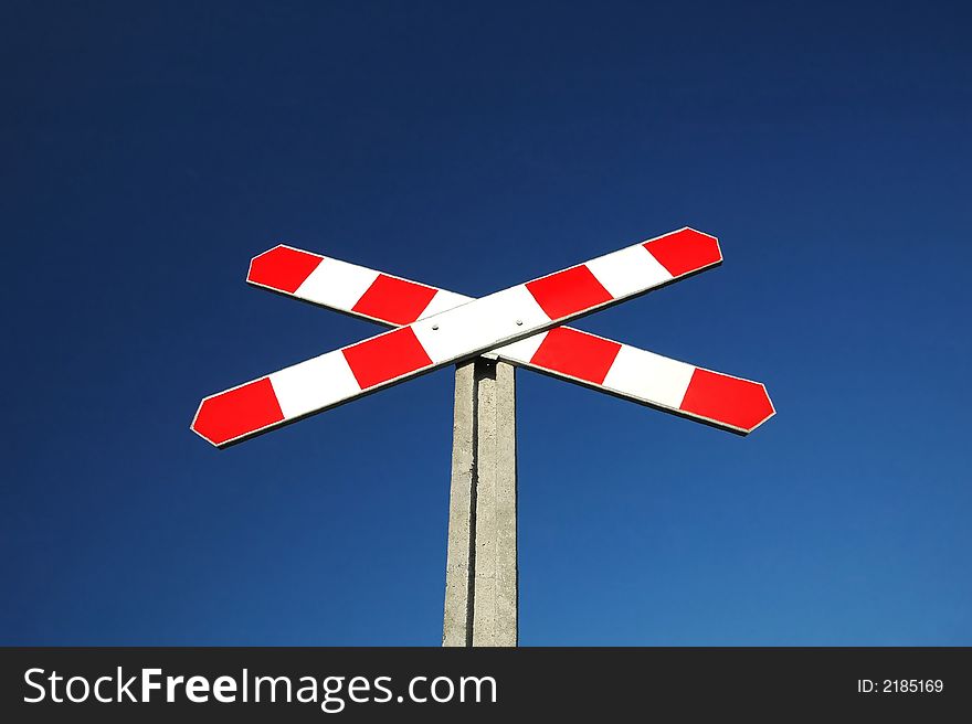 red-white railway sign on blue