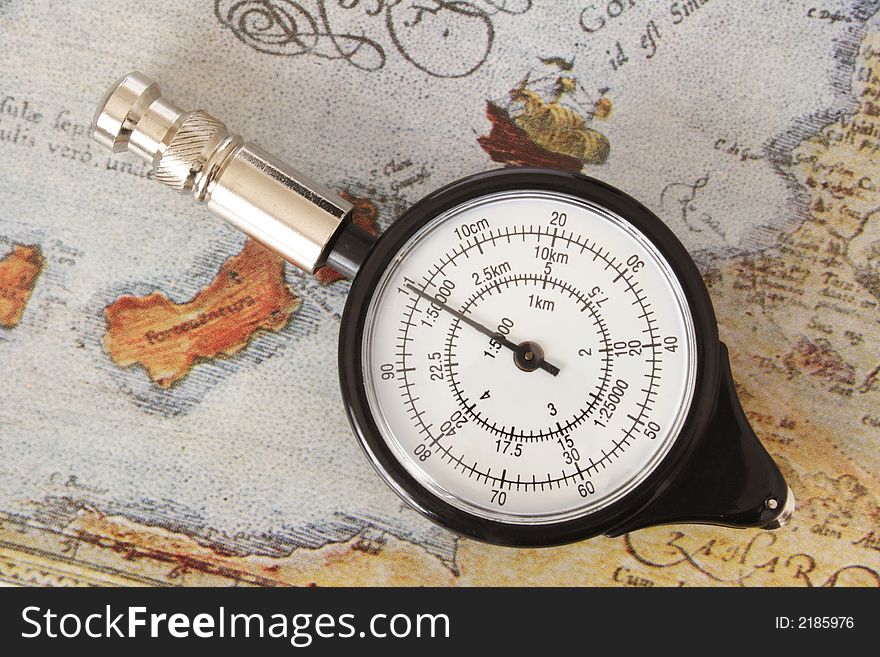 Map measurer on an old map. Map measurer on an old map