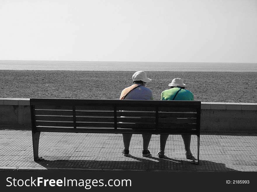 Sharing their loneliness on a bech by the sea