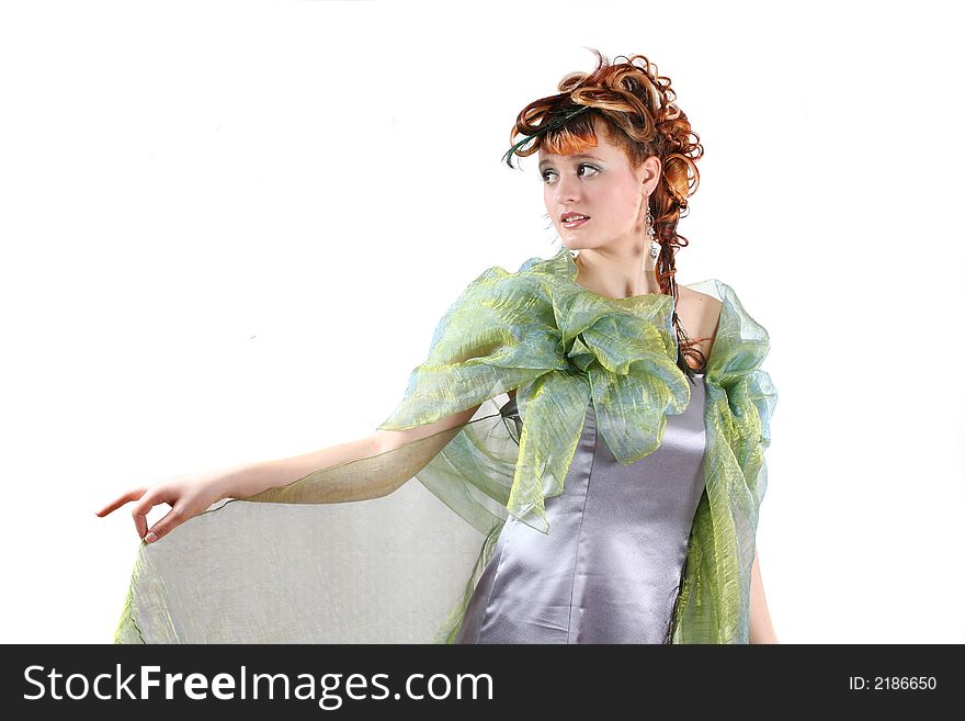 Portrait of the girl in a beautiful dress with a creative hairstyle. Portrait of the girl in a beautiful dress with a creative hairstyle