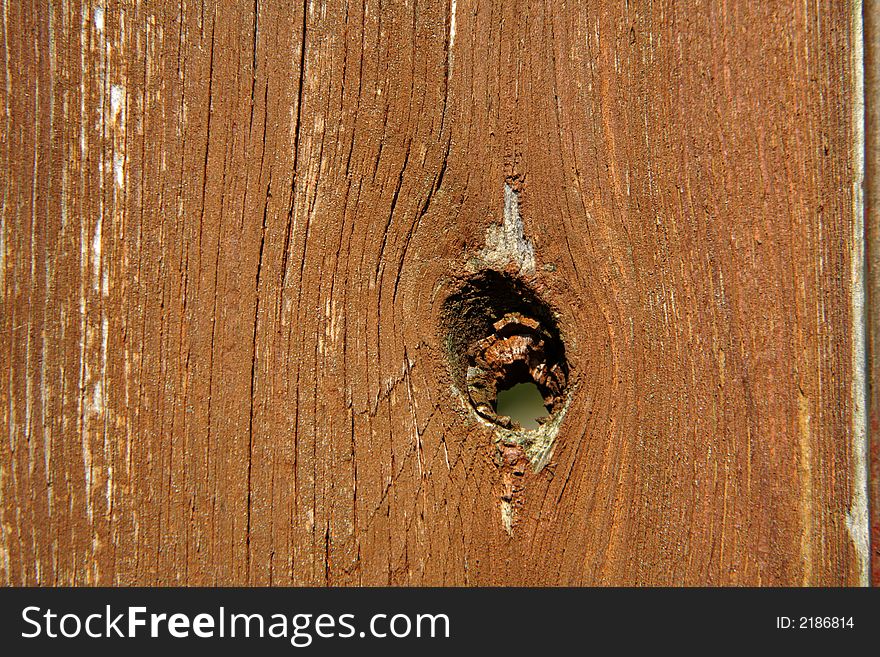 An old wooden board with hole