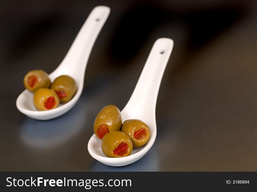 Stuffed green olives in two wh