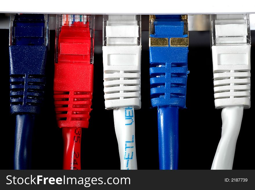 Network cable in three different colors witha black background. Network cable in three different colors witha black background