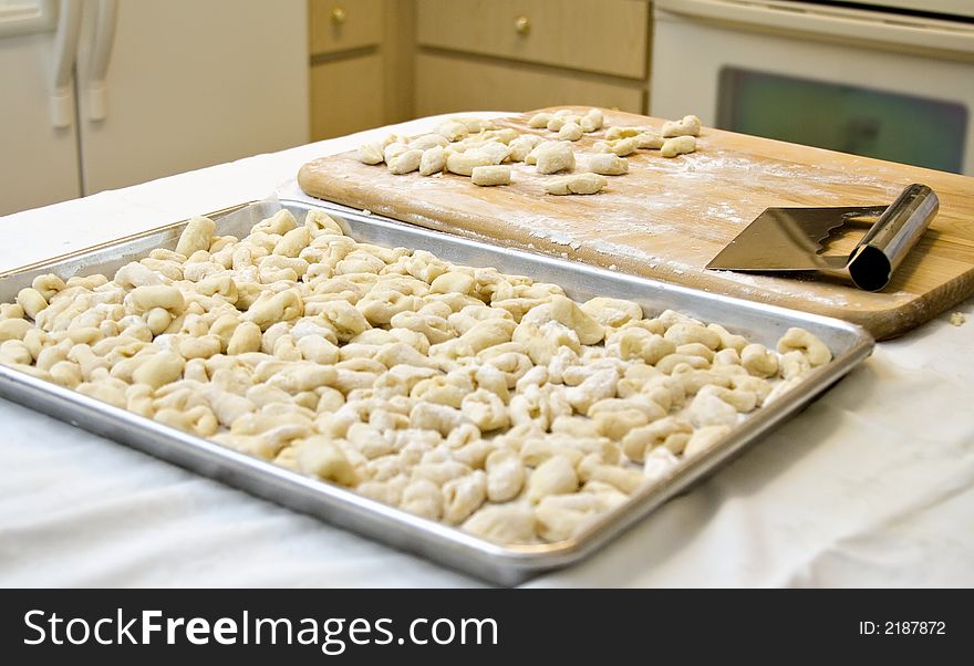 Fresh homemade gnocchi just prepared and ready to be boiled. Fresh homemade gnocchi just prepared and ready to be boiled.