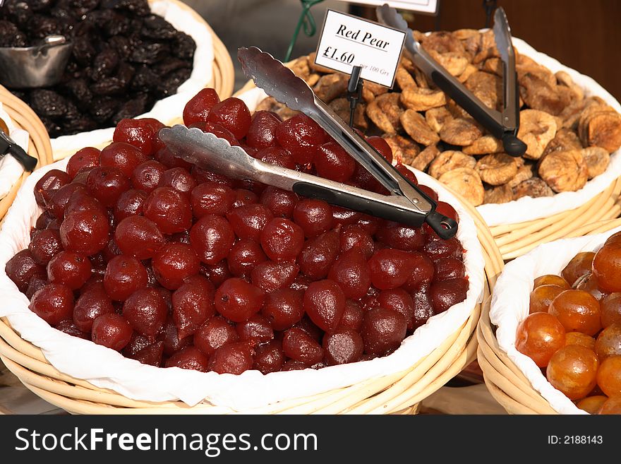 Dried red pears and others fruits in the baskets on the market