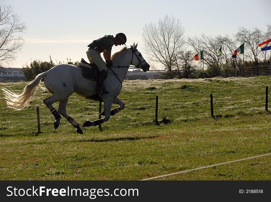 Horseman galloping at high speed in horse racing