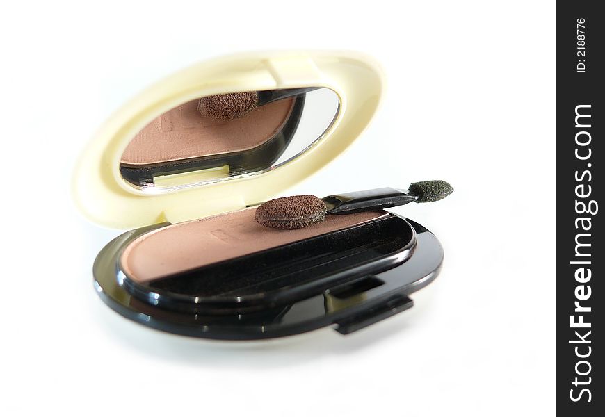 Natural eye shadow in case with mirror on white background