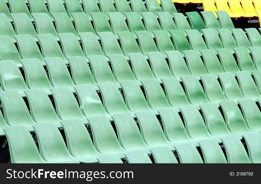 Many Empty Seats In Rows In An Outdoor Stadium. Many Empty Seats In Rows In An Outdoor Stadium