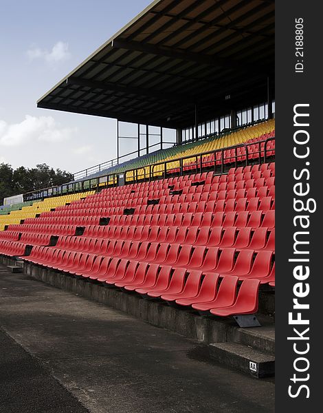 Many Empty Seats In Rows In An Outdoor Stadium. Many Empty Seats In Rows In An Outdoor Stadium