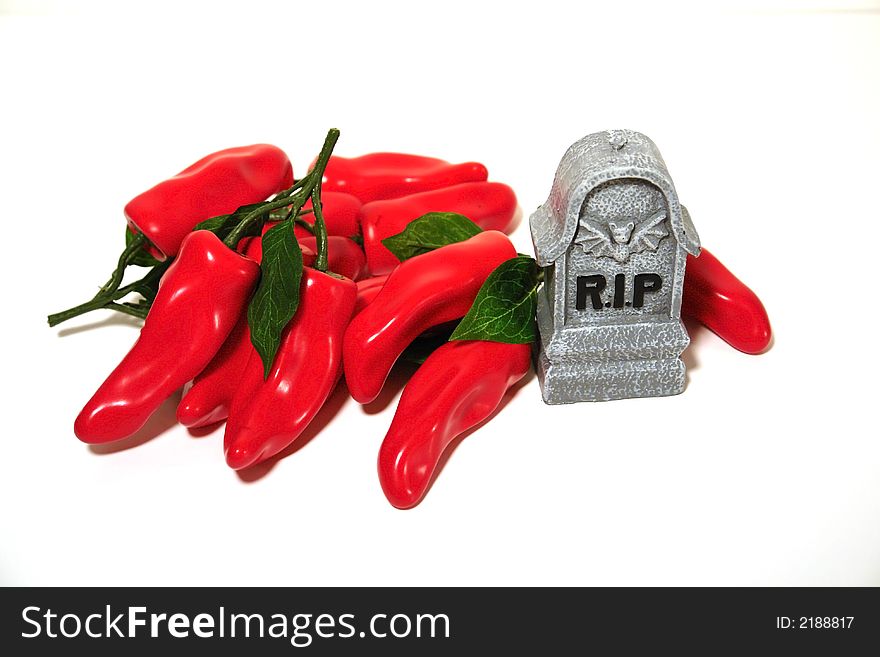 Hot red peppers with toobmstone isolated over white. Hot red peppers with toobmstone isolated over white