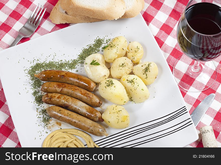 Grilled German sausages with potatoes. Grilled German sausages with potatoes