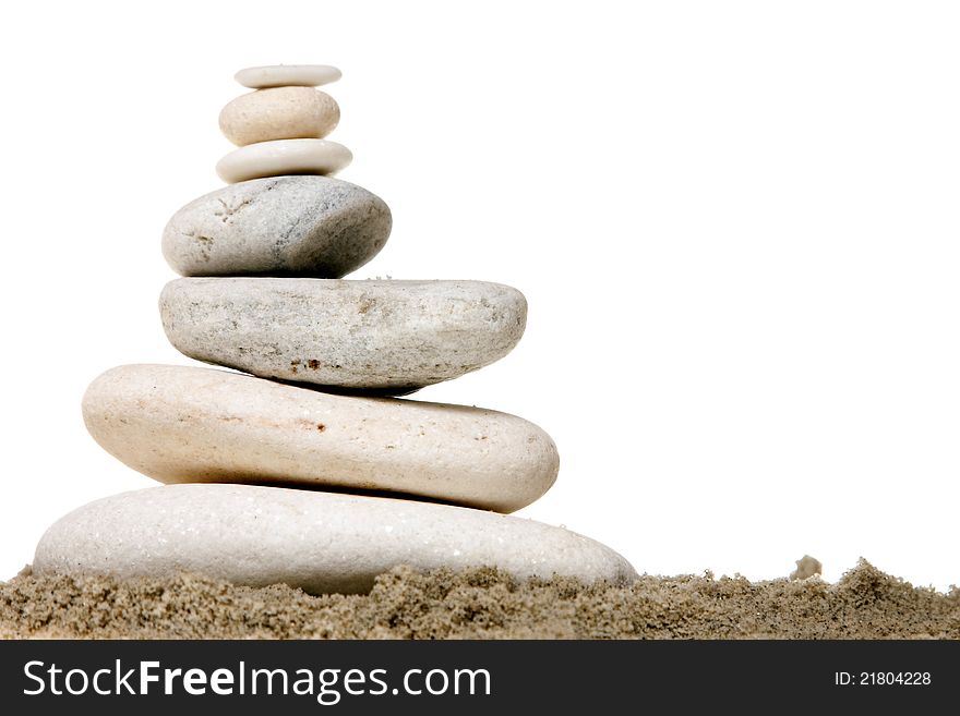 Stack of white stones balancing isolated on white