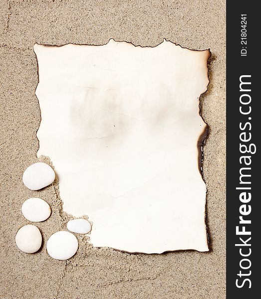 Holiday concept, Old paper tag on natural sand with pebbles