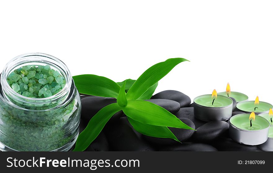 Stones, green candle and sea salt  isolated on white background. Stones, green candle and sea salt  isolated on white background