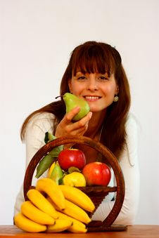 Woman Holding A Pear Stock Image