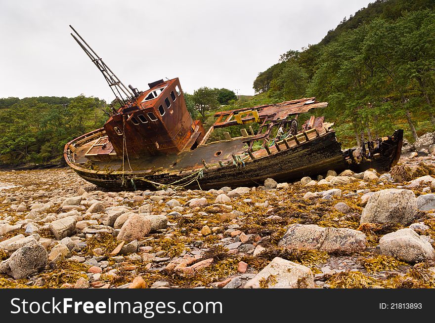 Wreck of fishing boat slowly falling into decay. Wreck of fishing boat slowly falling into decay