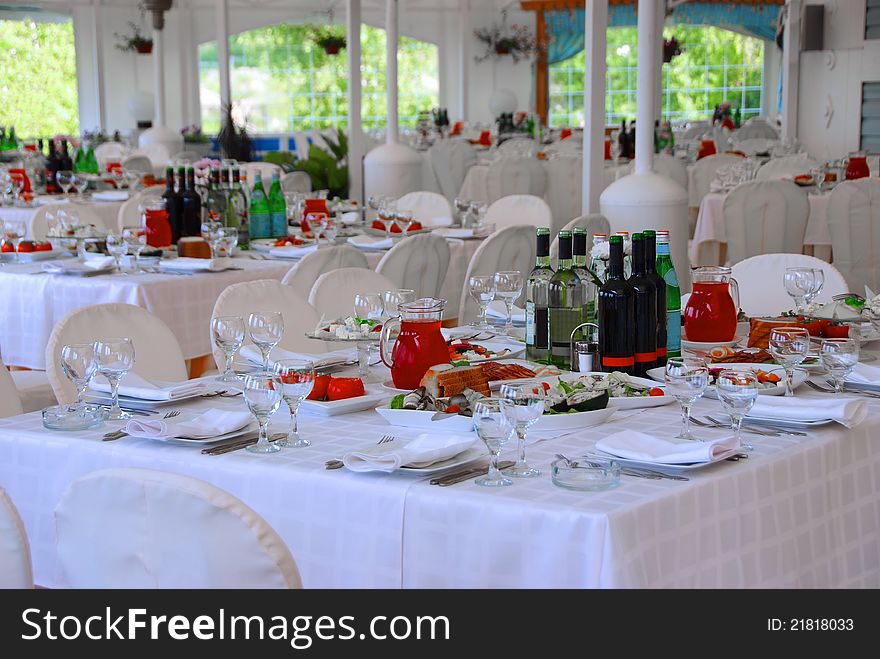 Tables at restaurant served for a banquet with tasty meals