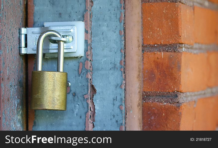 Door lock with red brick wall for security purpose. Door lock with red brick wall for security purpose.