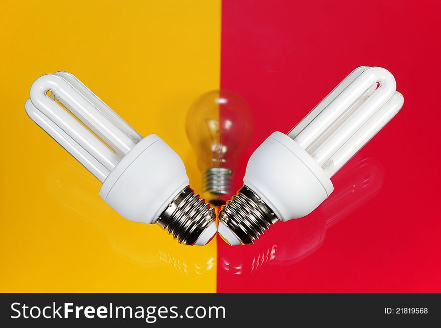 Light bulb on on colorful background