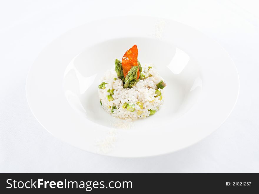 Risotto with asparagus isolated on white background.
