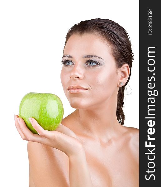 Beautiful girl holds in a hand green apple, isolated on white background