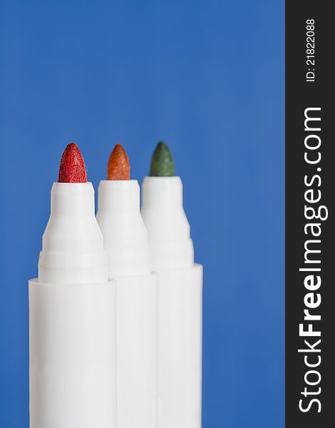 Three coloured marker pens