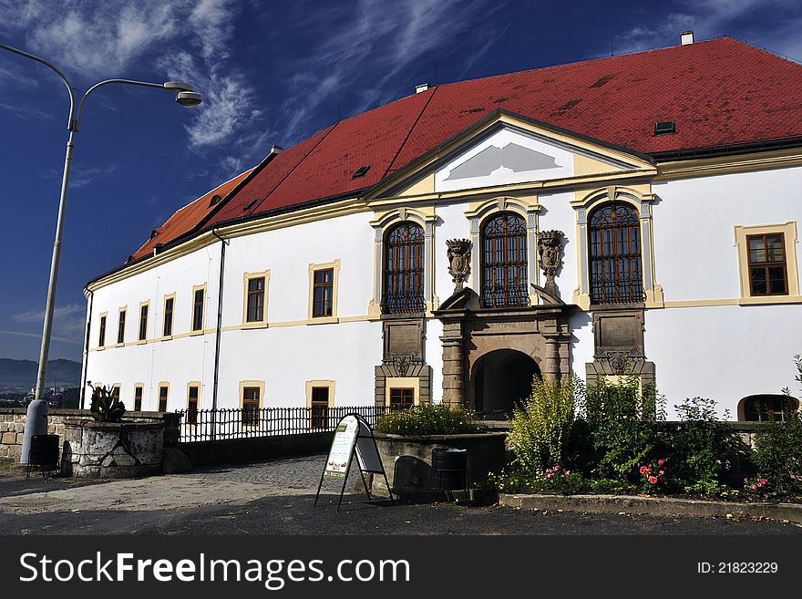 Famous Děčín´s baroque-classicistic (former renaissance) castle in Czech Republic - decorated white frontage on dark blue sky background. Famous Děčín´s baroque-classicistic (former renaissance) castle in Czech Republic - decorated white frontage on dark blue sky background