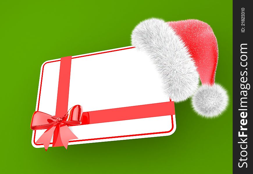 Santa hat with a gift card isolated on a green background