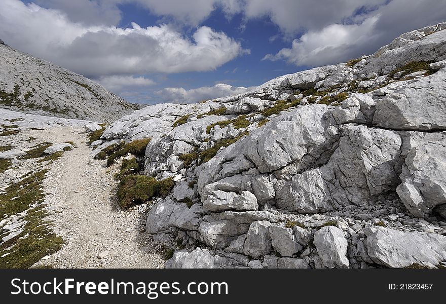 A rocky track runing to the top of mountain. A rocky track runing to the top of mountain