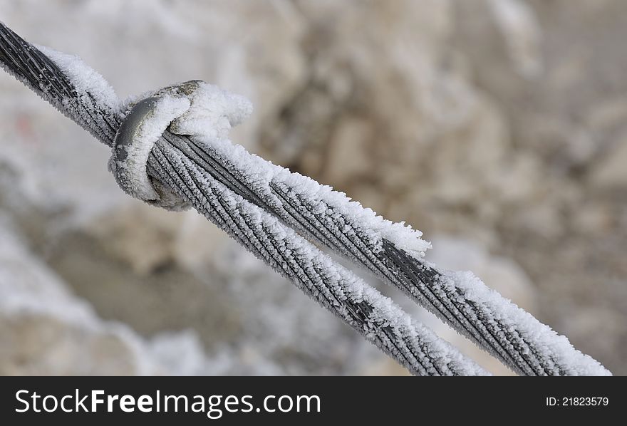 Detail of iron rope covered with ice or snow. Detail of iron rope covered with ice or snow