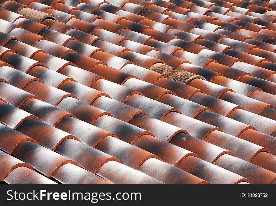 View of red roof tiles on diagonal. View of red roof tiles on diagonal