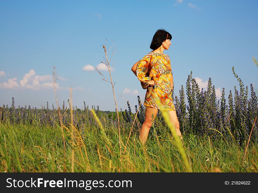 Woman alone on the flower field. Woman alone on the flower field