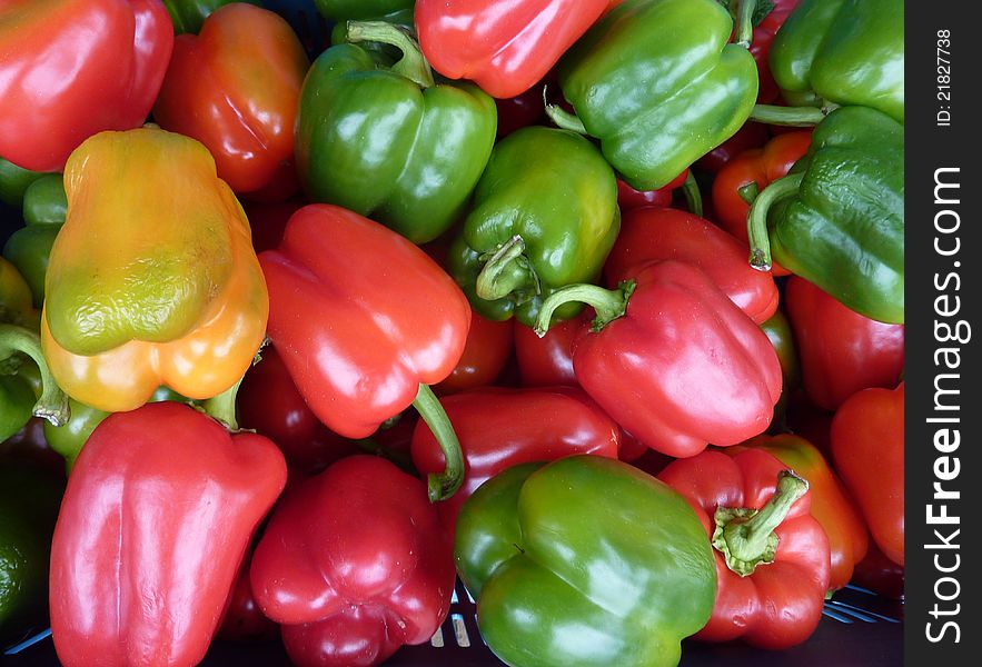 Colorful peppers in a box at the greengrocer on a market place. Colorful peppers in a box at the greengrocer on a market place