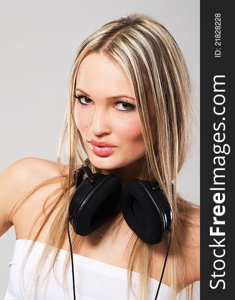 Beautiful blonde with big headphones. Beautiful blonde with big headphones