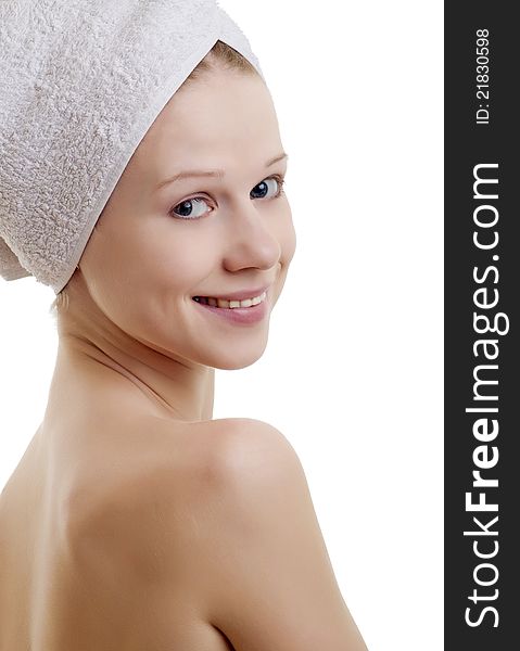 Portrait of a girl in a towel on a white background. Portrait of a girl in a towel on a white background