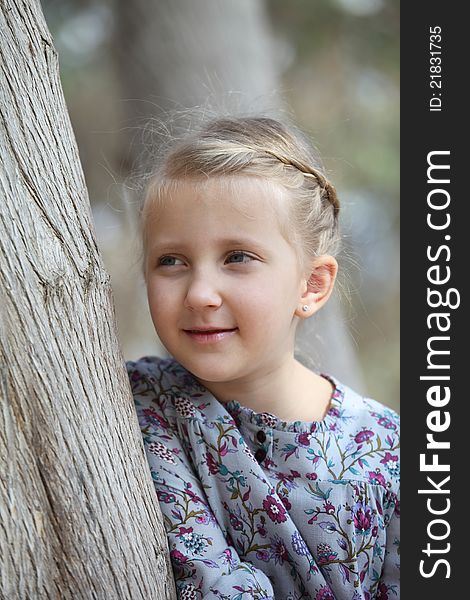 Portrait Of A Girl Near A Tree