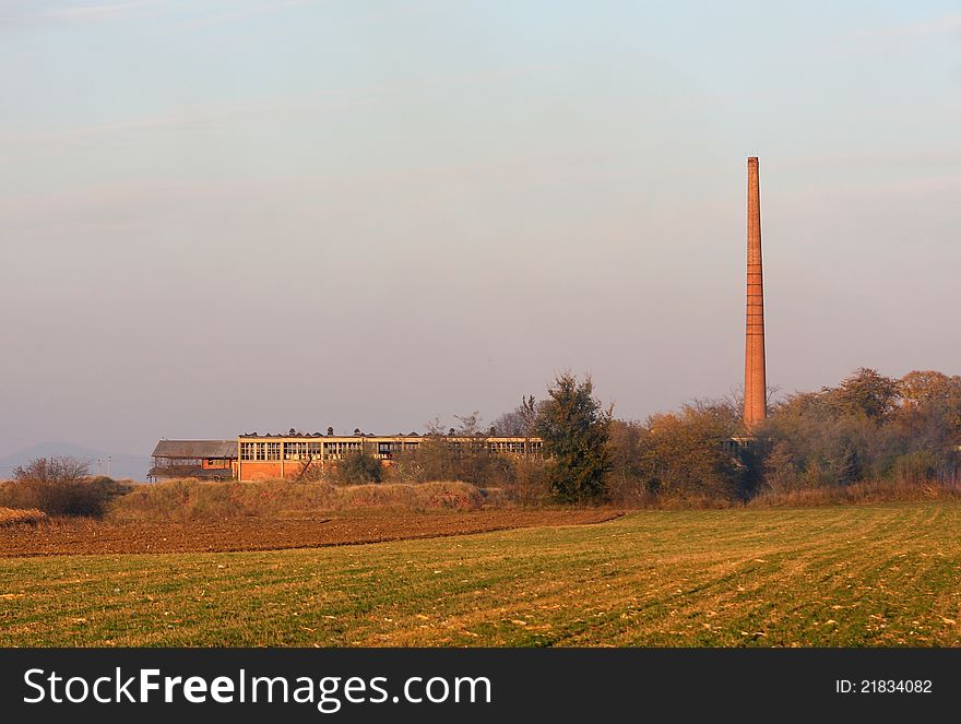 Abandoned old factory in the field. Abandoned old factory in the field